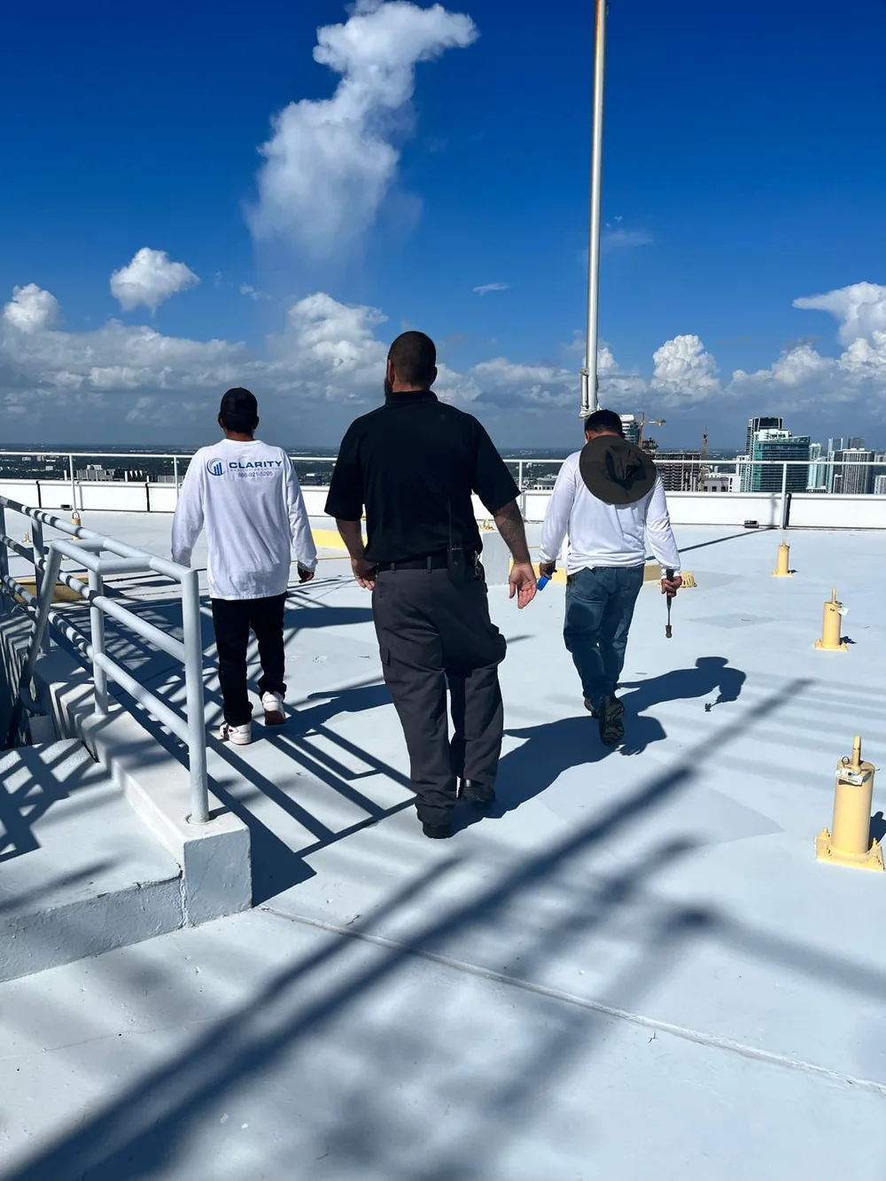 Clarity Roofing owner and team on a South Florida job site