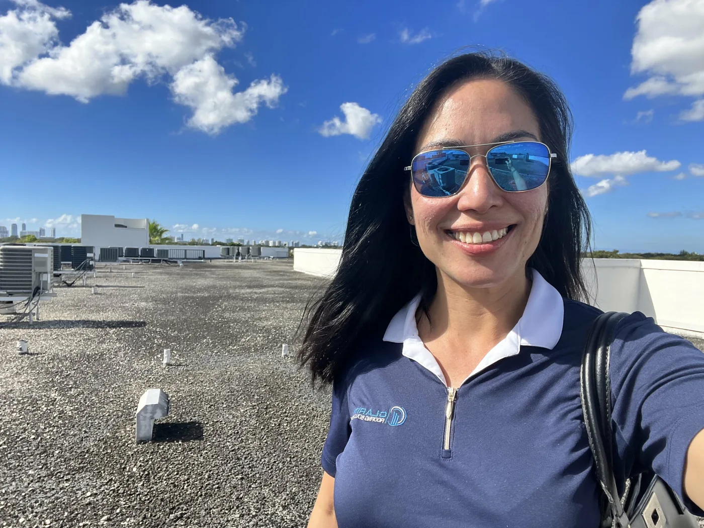 Clarity Roofing team walking on a South Florida commercial roof